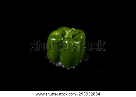 Colorful bell pepper vegetable on black background
