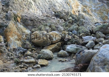 Volcano landscape of sulfur springs with white and grey rocks and yellow brimstone and milky water on Pulau Weh, Indonesia  Сток-фото © 