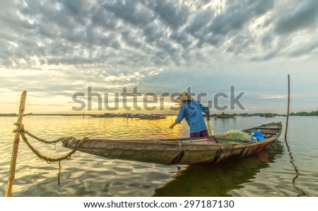 In Hue, Vietnam - June 21st, 2015, A man ominous morning nets at Tam Giang lagoon, Hue, Vietnam.