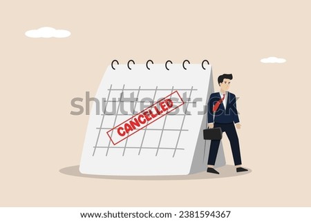 Canceled business trip, postponed or cancelled meeting, sad businessman standing with calendar with Red Canceled stamp.