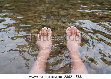 Dipping feet in water