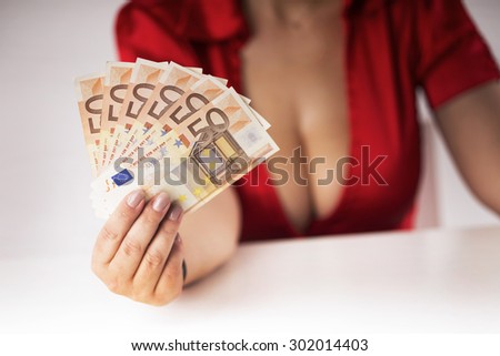 girl with large breasts holding banknotes