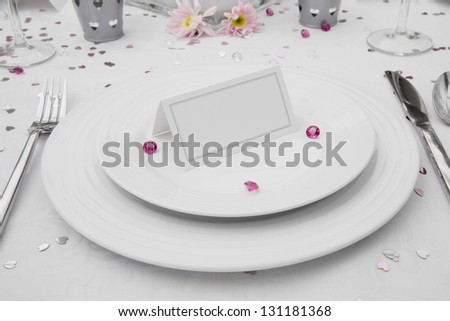 Wedding Table display with a blank place card on bone china plates