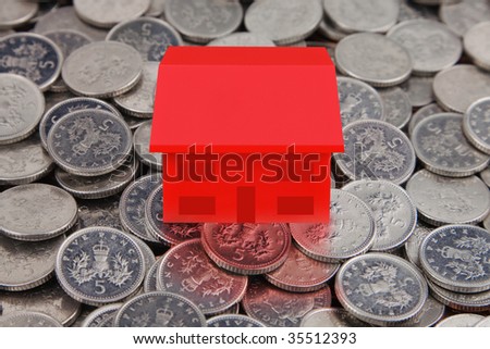 property market,Bank of England Coins with Red House placed on top
