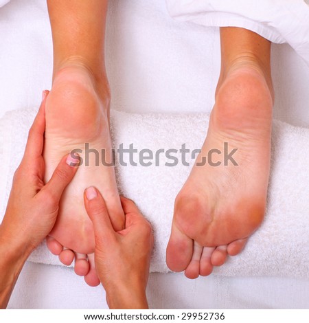 Massage and leaving of the female feet bared by a foot