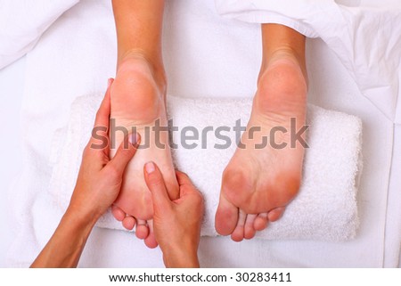 Massage and leaving of the female feet bared by a foot