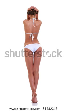 Young beautiful woman in white underwear costs a back in full growth on tiptoe, isolated on a white background, please see some of my other parts of a body images