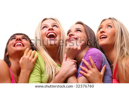 Four beautiful happy young women with a smile in bright multi-coloured clothes look upwards, isolated on a white background, please see some of my other parts of a body images