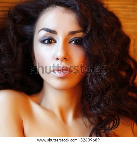 Beautiful young woman with magnificent twisted black hair