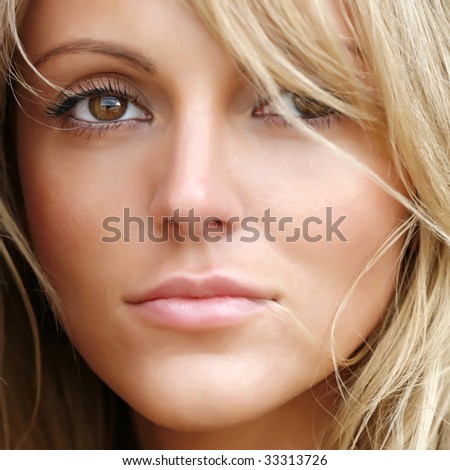 Portrait of the beautiful young woman with magnificent light hair, close up