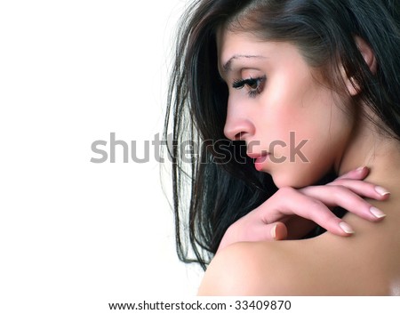 Portrait of the brunette with long hair with the hands lifted to a head, isolated on a white background, please see some of my other parts of a body images