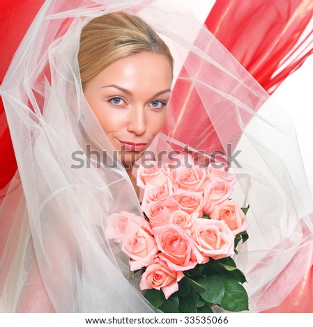 Beautiful young blonde in a veil and roses in hands, isolated on a white background, please see some of my other parts of a body images