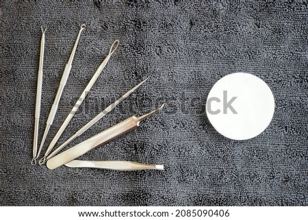 Dermatology and cosmetology concept. Set of tools. Blackhead remover, pimple extractor, acne removal. En gray background ストックフォト © 