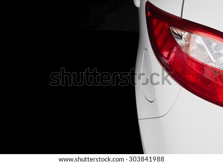 red taillight of a car on black background