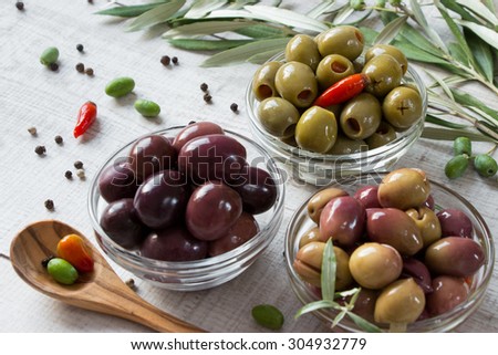 Similar – Image, Stock Photo Olives. A variety of green, black and red olives, with leaves, shot from the top with a place for text