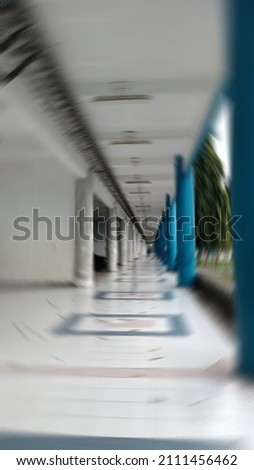 defocus background of elongated building hallway