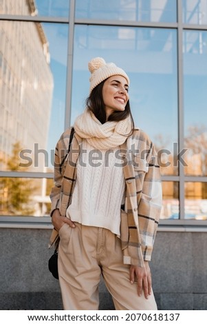 Image, Stock Photo girl in a winter hat sits on the porch of a Christmas house