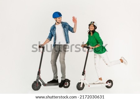 Similar – Image, Stock Photo Man riding an e-scooter