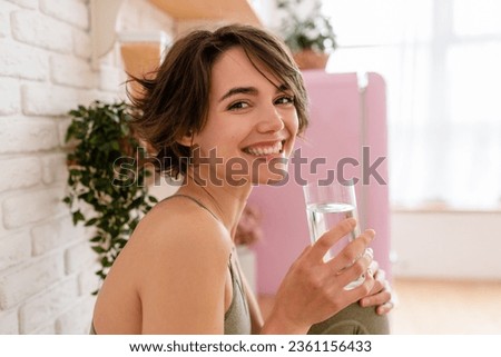 Similar – Image, Stock Photo Girl drinking from glass in the evening sun