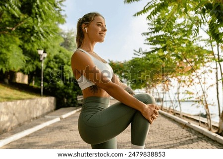 Image, Stock Photo Happy woman stretching legs during yoga class with trainer