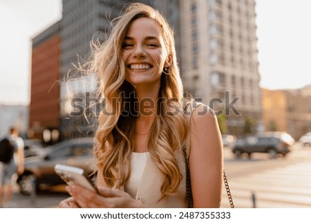 Similar – Image, Stock Photo Young casual female traveler at airport, holding smart phone device, looking through the airport gate windows at planes on airport runway.