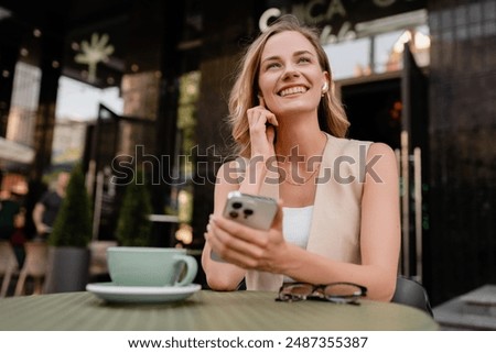 Similar – Image, Stock Photo Junge blonde Frau sitzt auf der Treppe im urbanen Raum