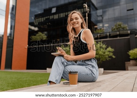 Similar – Image, Stock Photo Blond woman writing on clipboard bending on office desk