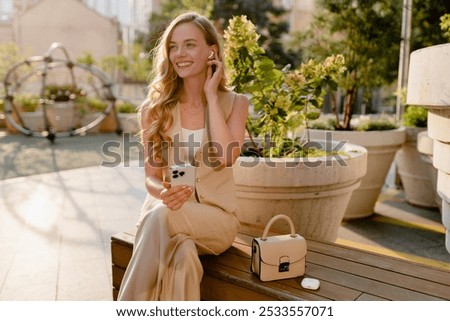 Image, Stock Photo Junge blonde Frau sitzt auf der Treppe im urbanen Raum
