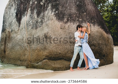 young stylish hipster couple in love on tropical beach during vacation honey moon, embrace, lovely, romance, tenderness, blue dress, tenderness