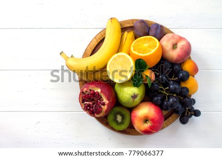 The concept of a healthy diet. Platter fruits and berries - orange, pear, apple, pomegranate, grapes, peach, apricot. Vegan cuisine. Flat lay. Top view. ストックフォト © 