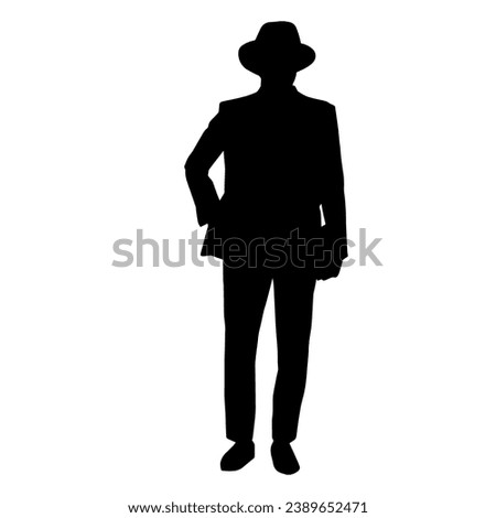 Silhouette of a gentleman in suit and wearing fedora hat 