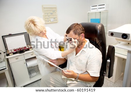 Doctor,examining a patient in ophthalmology clinic