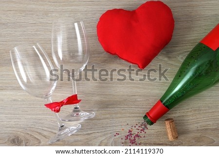 Similar – Image, Stock Photo empty wine glasses. Beautiful new glasses for wine from glass stand in even rows on a wooden table in a restaurant. selective focus