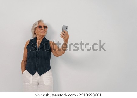 Image, Stock Photo Stylish elderly woman in round sunglasses