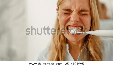 Similar – Image, Stock Photo Young woman with intense green eyes looks at camera
