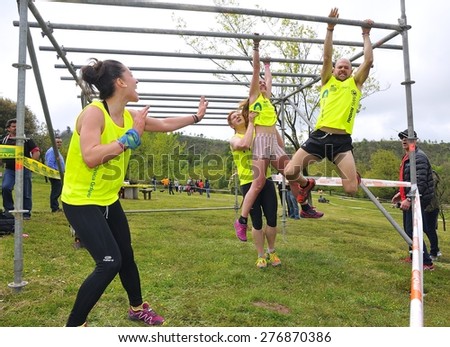 OVIEDO, SPAIN - MAY 9: Storm Race, an extreme obstacle course in May 9, 2015 in Oviedo, Spain. Runners going on an obstacle in the Storm Race of Oviedo.