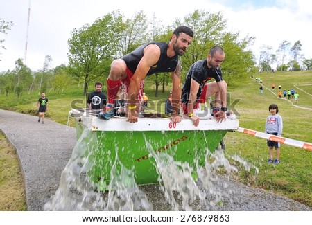 OVIEDO, SPAIN - MAY 9: Storm Race, an extreme obstacle course in May 9, 2015 in Oviedo, Spain. Runner in the container of ice water.