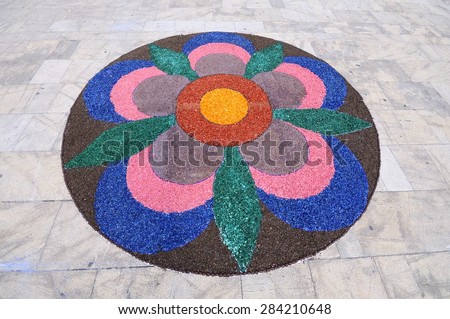 PRAVIA, SPAIN - JUNE 4: Carpets of flowers for the celebration of Corpus Christi  in June 4, 2015 in Pravia, Spain. Fifty housewives have been working with flowers, wood chips and tinted salts.