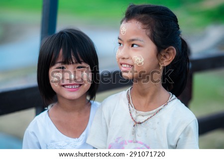 Sangklaburi,Thailand May 31: Unidentified young asian girl smile with thanaka powder on face of this \