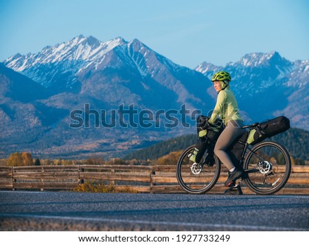 Similar – Image, Stock Photo Woman with bicycle seeks way on smartphone