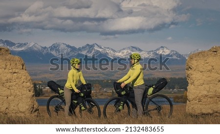 Similar – Image, Stock Photo Woman with bicycle seeks way on smartphone