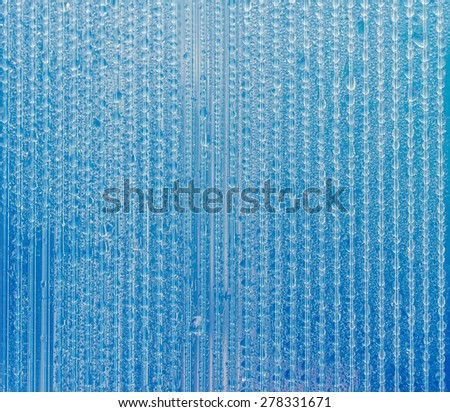 fabulous water droplets on the wall polycarbonate backlit dramatically lit by the sun. different color settings. finishing in the space lab. for interesting ideas. for background.