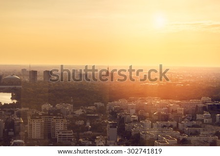 Sunset seen through window from 34th floor in Bucharest
