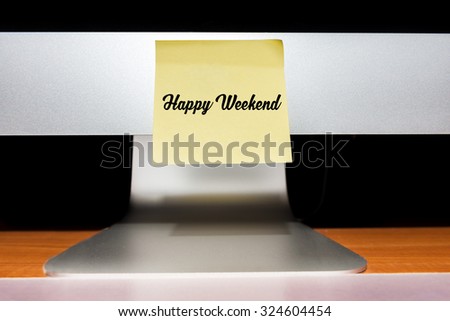 The words Happy weekend written on stick note on computer to remind you an important appointment.