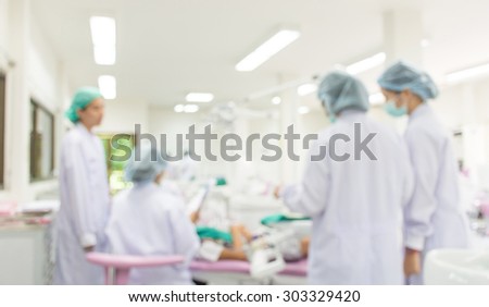 Blurred image of dentist team working background