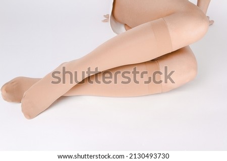 Medical Compression Stockings for varicose veins and venouse therapy. Compression Hosiery. Sock for sports isolated on white background. Black color socks mock up for advertising, branding, design. ストックフォト © 