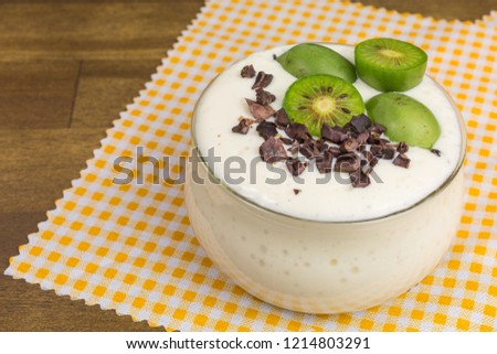 soy bean curd dessert with mini kiwi and cocoa nibs Photo stock © 
