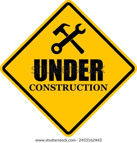 Sign under construction. Yellow diamond shaped warning road sign. Diamond road sign. Rhombus. Construction sign.
