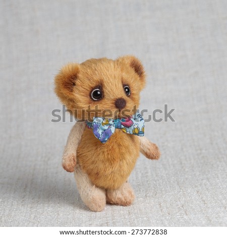 Brown artist Teddy bear with bow tie
