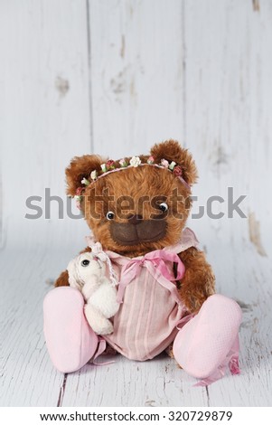 Brown artist teddy bear in pink dress one of kind.